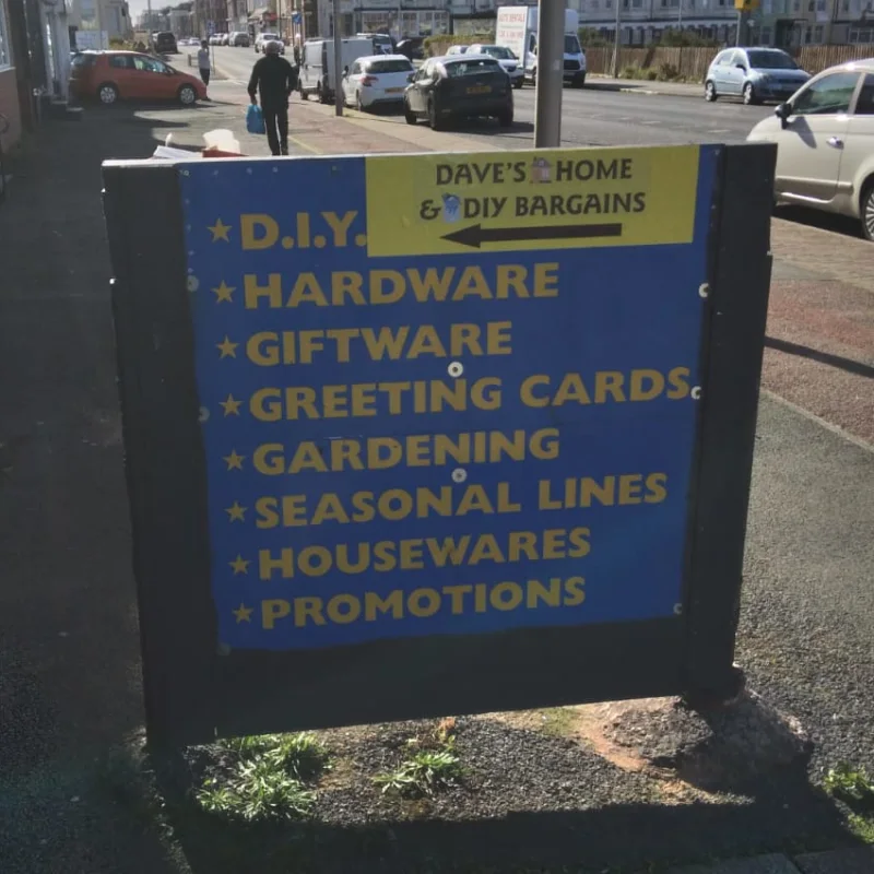 Dave’s pavement sign listing hardware, giftware and household supplies
